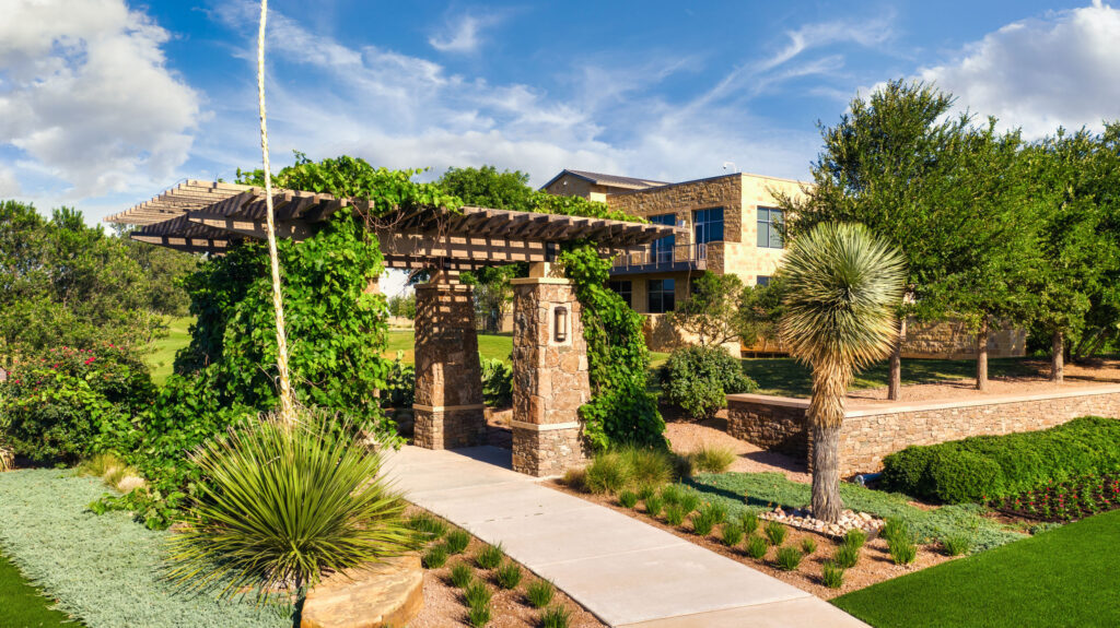 View of the decorative stone pergola and walkway at the Vineyard entrance