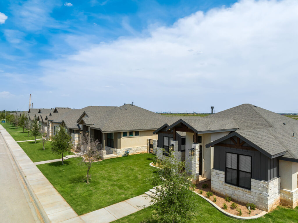 Street view of Vineyard homes showcasing different modern designs, manicured yards, and spacious driveways