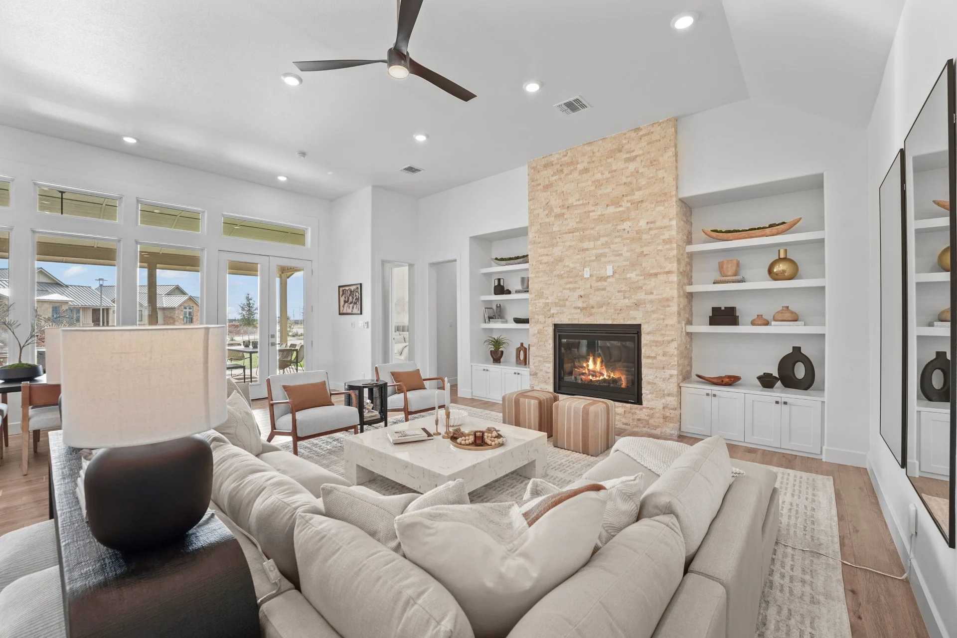 Garden home living room with gas fireplace and integrated shelf space