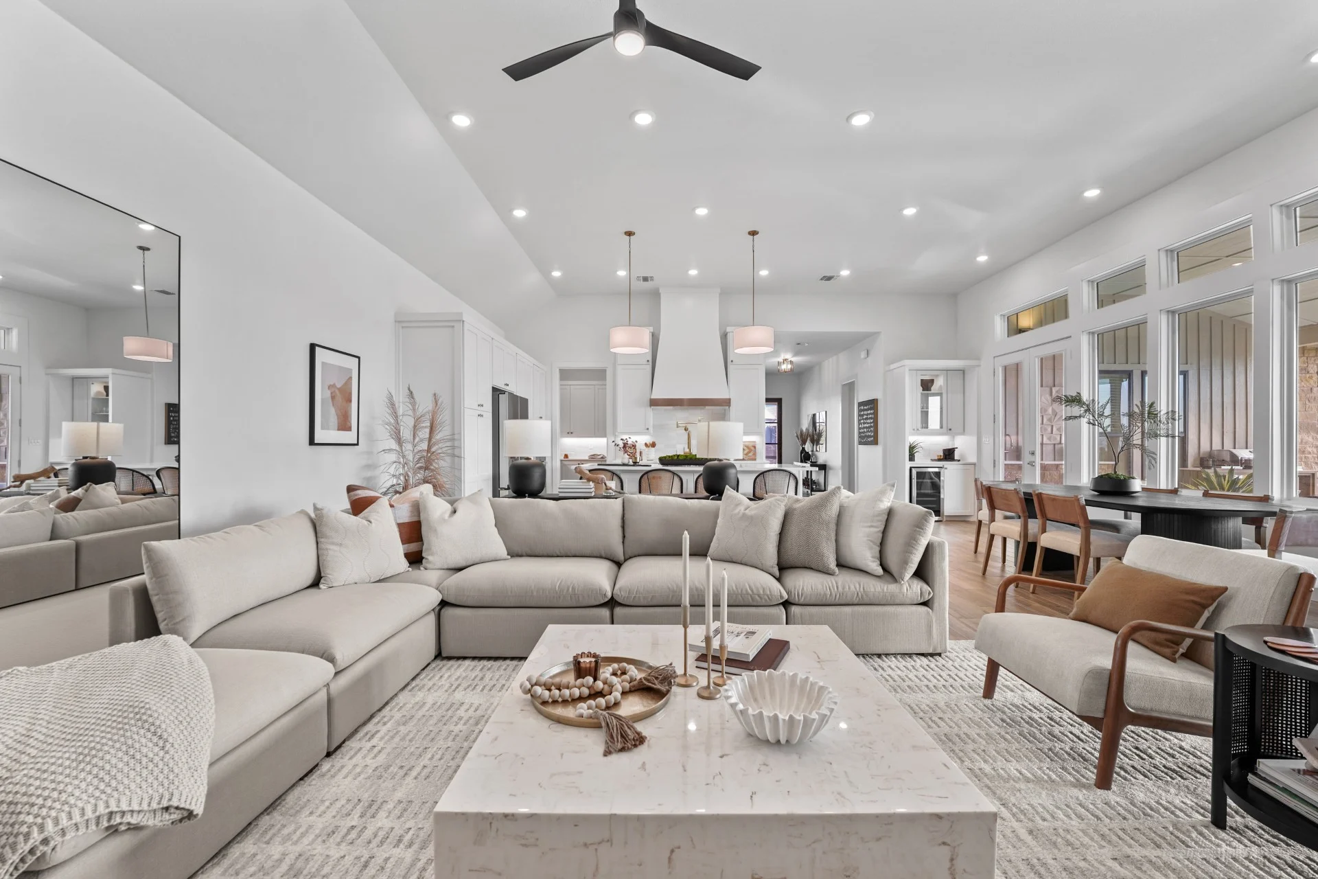Decorated open plan living room in the Vineyard's new garden home model home