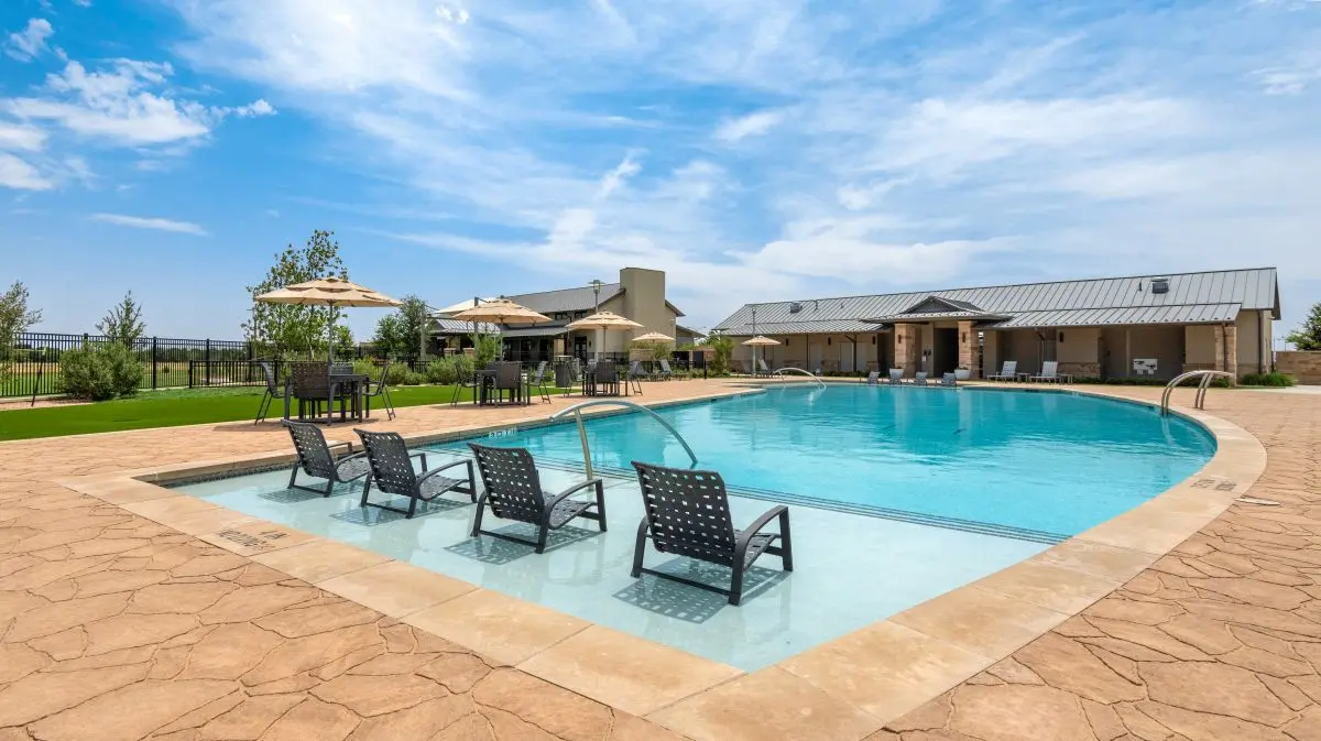 View of The Vineyard Preserve's pool with lounge chairs and shaded seating.