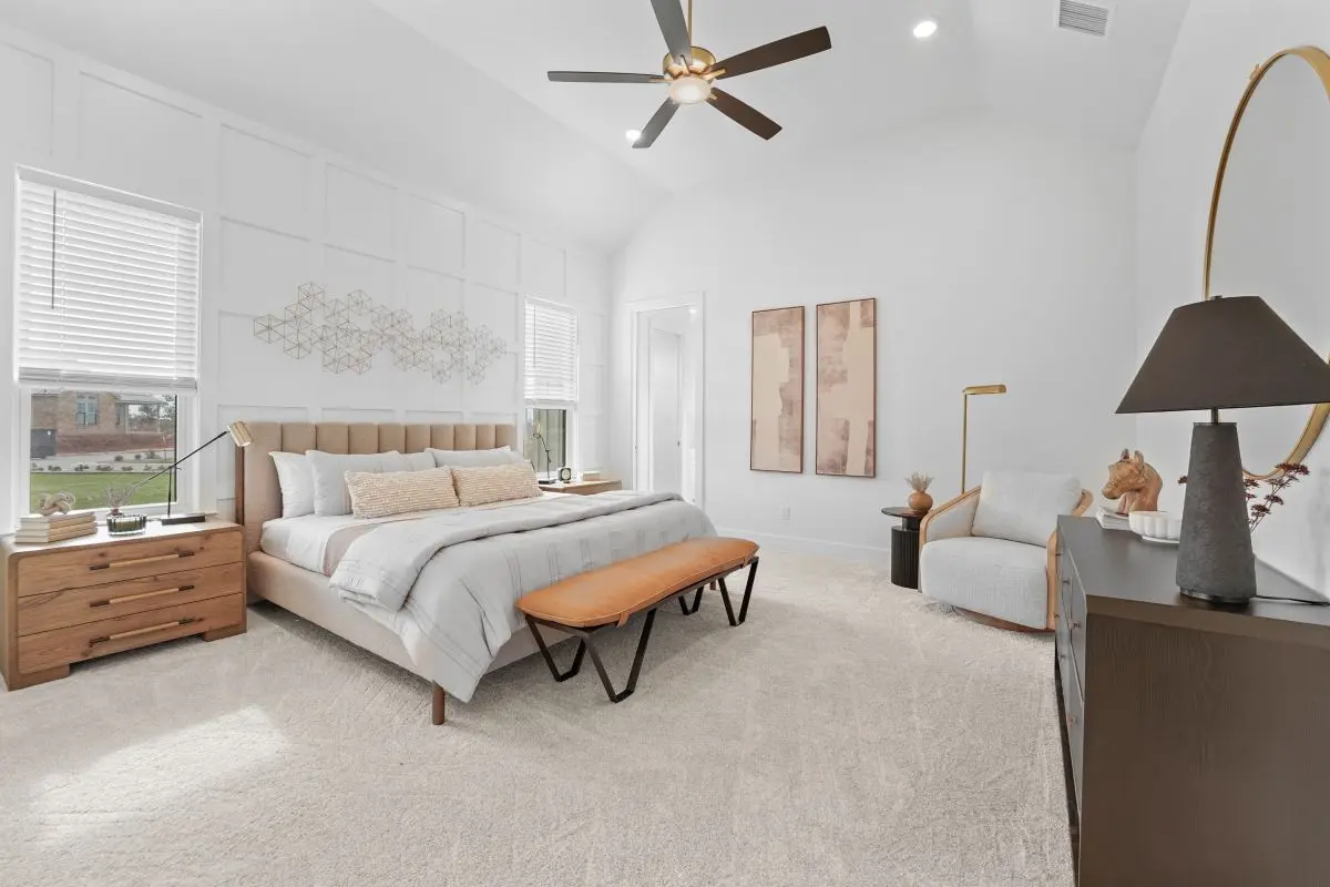 Bedroom in The Vineyard Preserve home. Spacious bed with high ceilings.